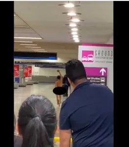 woman naked at airport - Travel Off Path