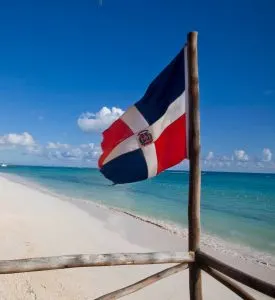 Dominican Republic flag on beach