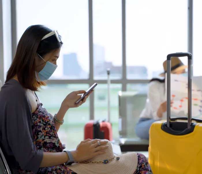 woman mask thailand travel suitcase