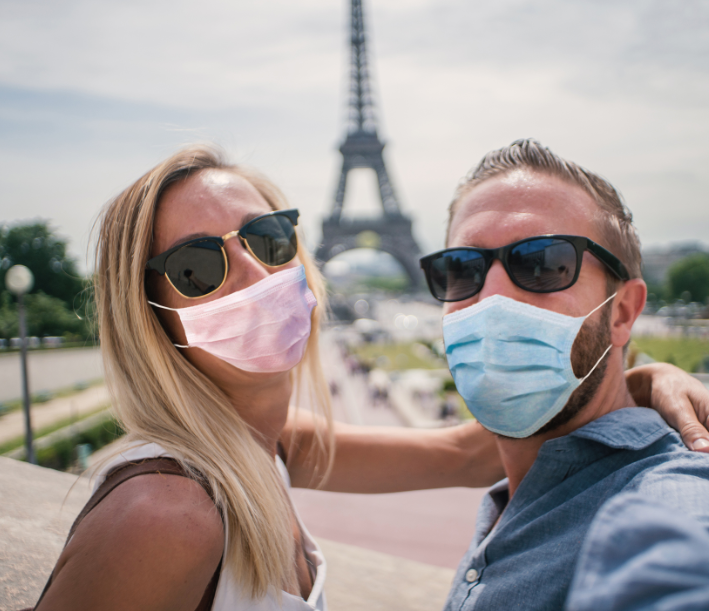 couple paris masks eiffel tower