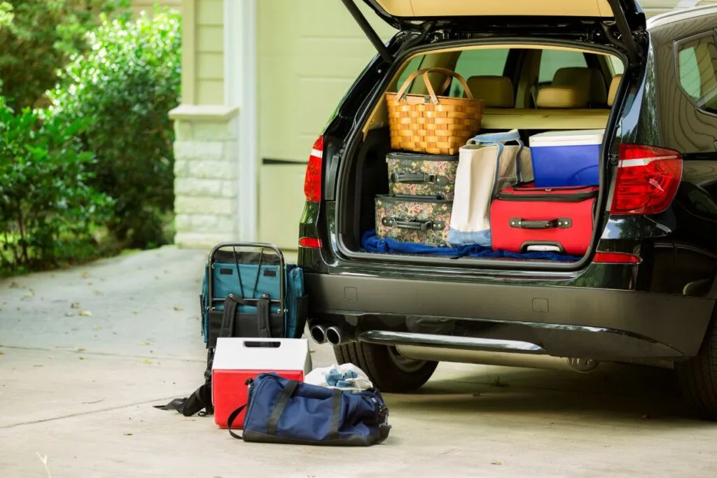 packing car suitcases coolers