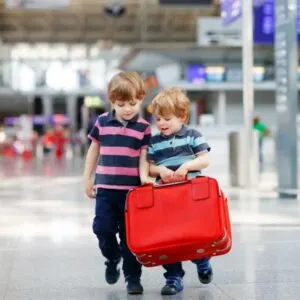 Children Carrying Bags At The Airport, International Travel