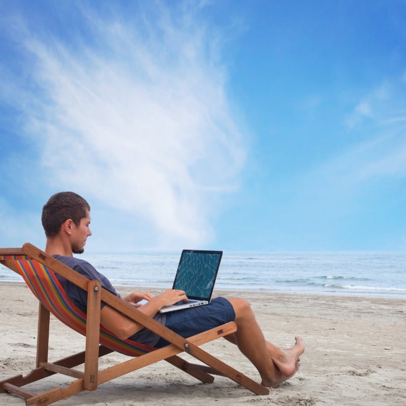 Male Digital Nomad taking care of A Beach place