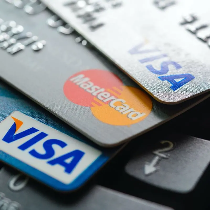 Group Of Credit Cards Arranged On Top Of A Computer Keyboard