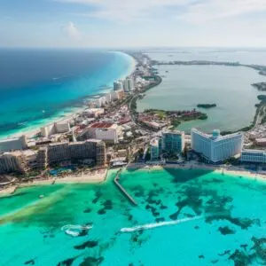 Aerial panoramic view of Cancun beach and city hotel zone in Mexico. Caribbean coast landscape of Mexican resort with beach Playa Caracol and Kukulcan road. Riviera Maya in Quintana roo region on Yucatan Peninsula