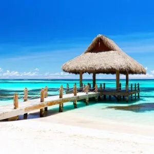 Panorama of beautiful gazebo on the tropical white sandy beach in Punta Cana, Dominican Republic.