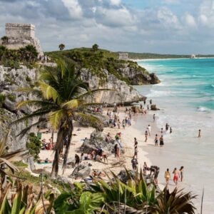 tourist by the Tulum ruins