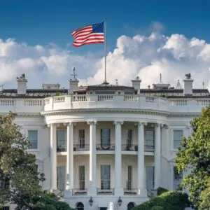 US Flag Flying Over The White House In Washington DC, United States of America