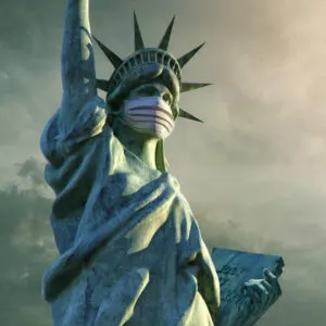Close Up Shot Of Statue Of Liberty Wearing A Face Mask During Covid Pandemic, New York City, United States