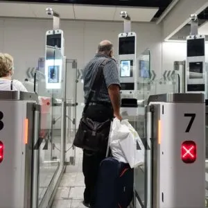 Passenger Scanning Boarding Pass Or Passport At Airport E Gate