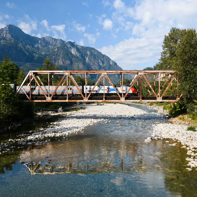 Amtrak Train Crossing A Bridge