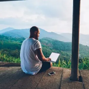 Remote Worker Working From His Laptop In A Nature Setting