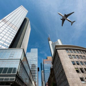 Plane Flying Above Skyscrapers In Frankfurt, Germany