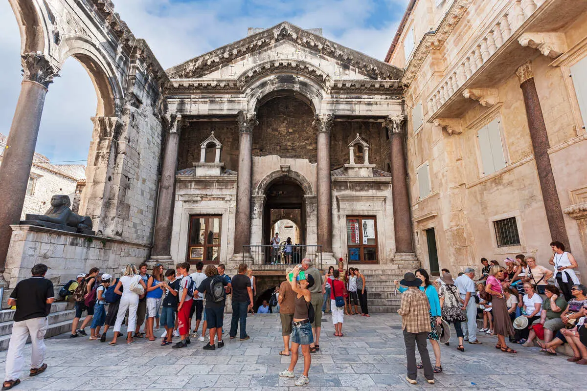 Tourists Walking The Square Inside Dioecletian's Palace In Split, Croatia