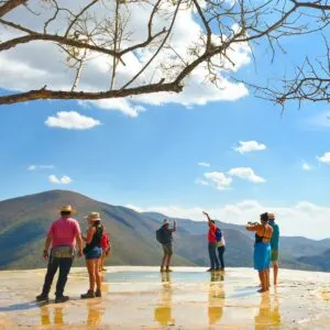 Tourists during the day at Hierve el Agua "the water boils" is a set of natural rock formations in the Mexican state of Oaxaca that resemble cascades of water in Oaxaca de Ju&aacute;rez, Oaxaca, Mexico.