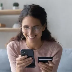Woman booking flights on her phone