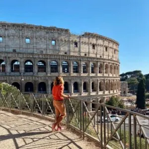Young Male Tourist Posing By The Colosseum, Rome, Italy