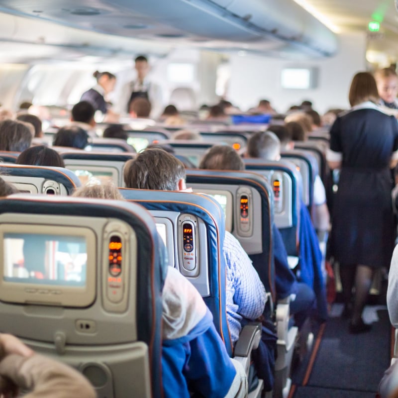 Interior of large passengers airplane with people