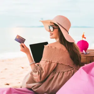 Woman on Beach with Credit Card