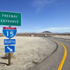 Mojave desert freeway and interstate 15 sign near Baker California.
