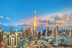 Skyline Of Dubai, United Arab Emirates, With The Tallest Building In The World Burj Khalifa Reflecting The Sun Shine And A Sea Of Skyscrapers Surrounding It, Middle East