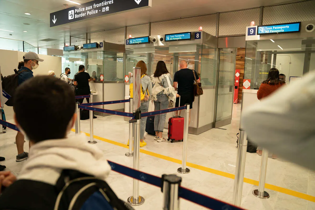 Travelers Undergoing Border Control In An Airport In France, Europe