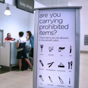 a sign at the airport indicates which items are prohibited on aircraft