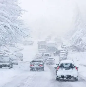 Cars in a crash on the road because of a snow storm
