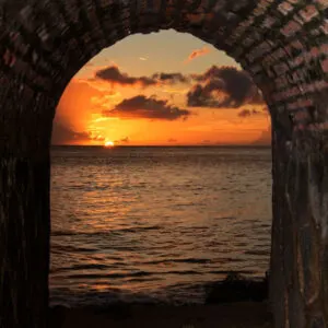 Sunset in a Colonial tunnel in Rinc&oacute;n beach Puerto Rico