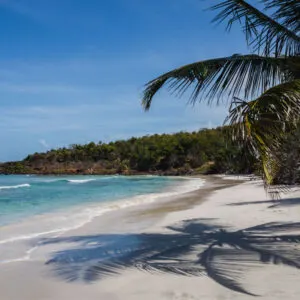 The Caribbean Sea and white sand backdrop of Playa Zoni beach on a sunny day in Culebra, Puerto Rico