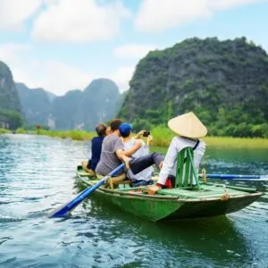 Tourists On A Boat In A Picturesque River In Vietnam, Southeast Asia