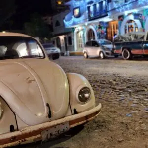 Volkswagen Bug on cobblestone streets of puerto vallarta at night