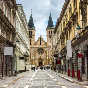 Beautiful Old European Street Lined With Historical Buildings Culminating In A Cathedral In Sarajevo, Bosnia and Herzegovina, Eastern Europe
