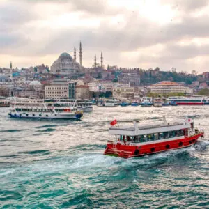 Boats And Passenger Ferries Crossing The Bosphorus Strait Facing The Historical Peninsula On The European Side Of Istanbul, Turkey