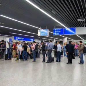 People in line at Frankfurt airport in Germany waiting for immigration officials to stamp their passports