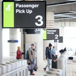 passengers wait for pickups outside the newark airport