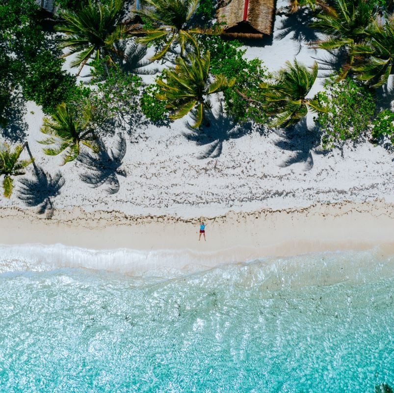 Aerial veiw of man on a beach in dominican republic