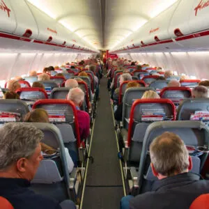 Interior Of A Jet2 Aircraft Cabin With Passengers Allocated To Their Seats, Air Travel In Europe