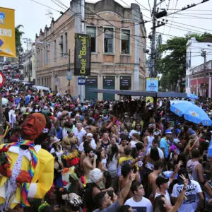 Street Carnival in Rio de Janeiro, crowd of people celebrate on the street with Blocos, individual groups who plan the parties with bands and samba music.