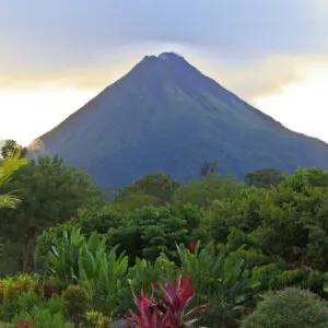 A lush garden in La Fortuna, Costa Rica with Arenal Volcano in the background
