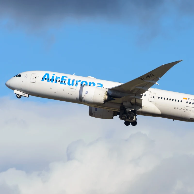 Air Europa Boeing 787 Dreamliner flying in front of blue sky.