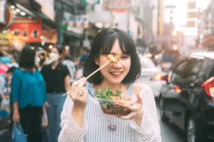 Woman eating street food
