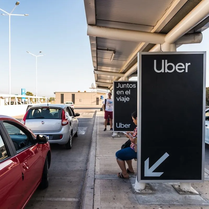 Uber pickup sign at airport in Argentina