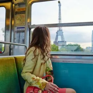 Woman Admiring The Eiffel Tower As The Metro Crosses A Bridge Spanning The River Seine, Paris, France, Europe