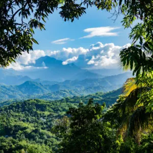 a distant view of the blue mountains in Jamaica under blue skies