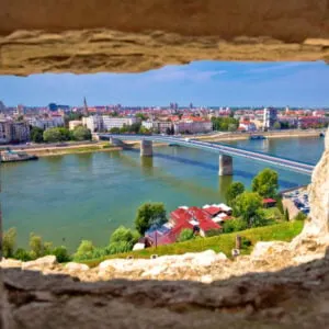 City Of Novi Sad and Danube river aerial view through stone window from Petrovaradin, Vojvodina region of Serbia