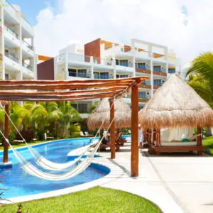 Swimming pool and hammock. Luxury exotic resort.