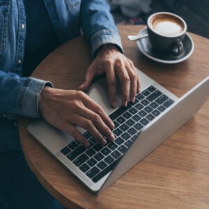 man at laptop with coffee