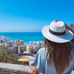 Woman Overlooking Malaga In Spain, Andalusia Coast, Southern Europe