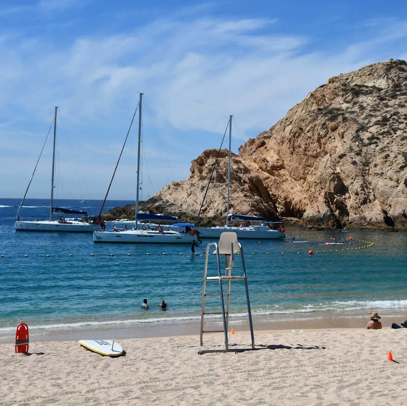 Tourist Boats Docked By A Beach In Los Cabos, Baja California Sur, Mexico